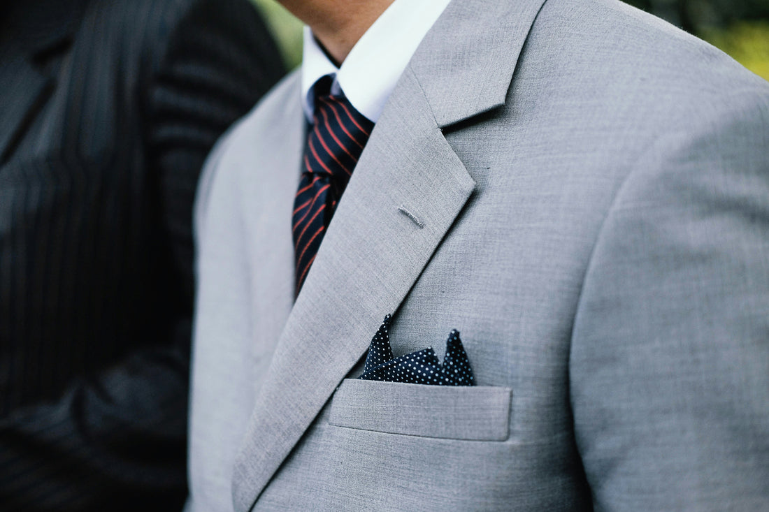 Stylish man's business suit. Photo by Hardini Lestari on Unsplash.